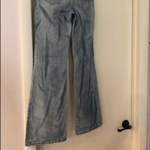 Flare Jeans with lace inlet on bottom.